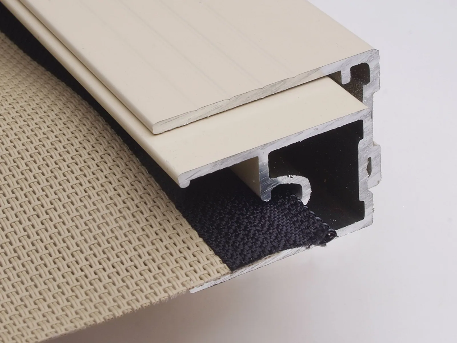 Zipscreen inner channel cutaway showing the fabric retention