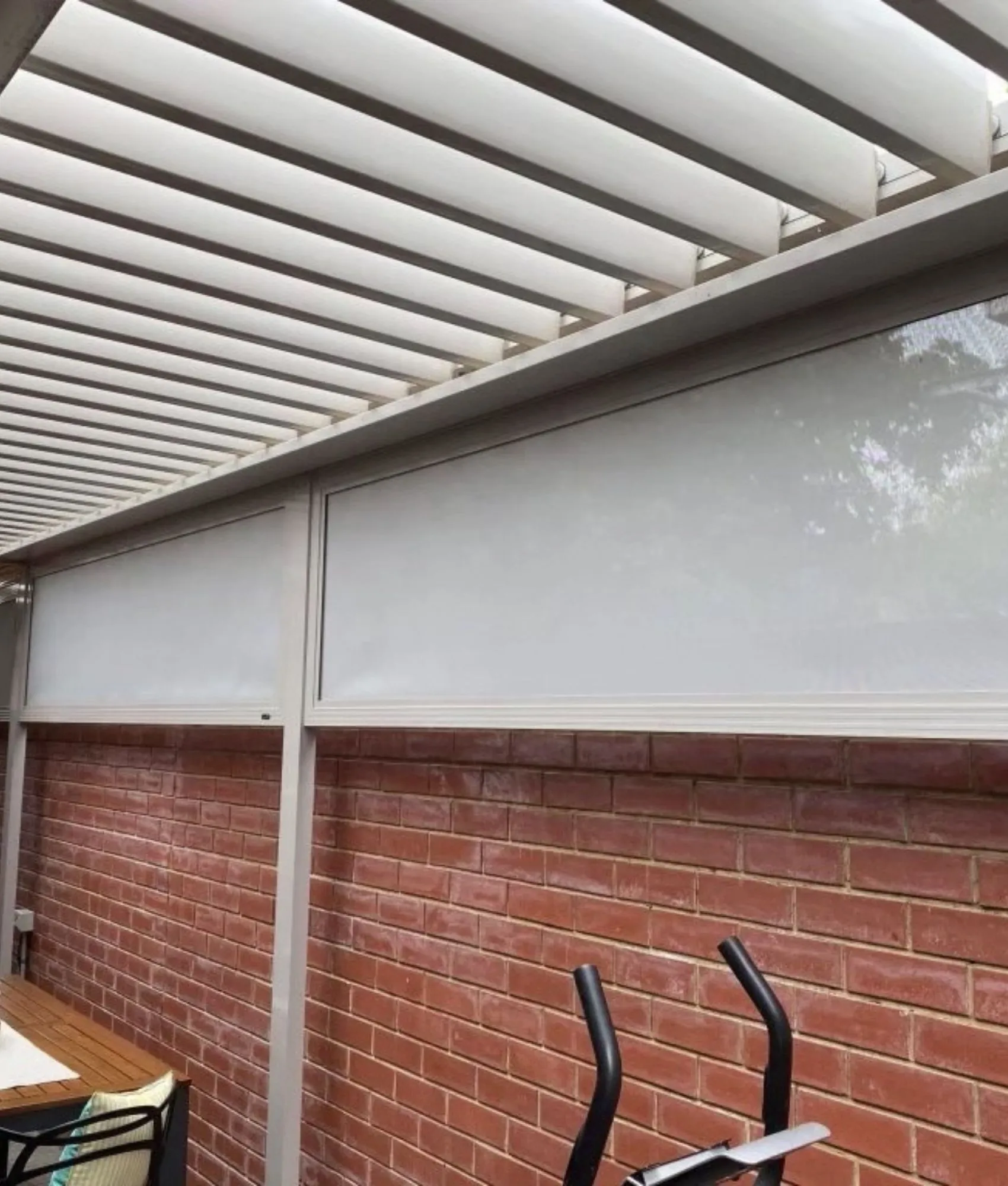 Fixed infill panel blind fitted to an outdoor entertaining area
