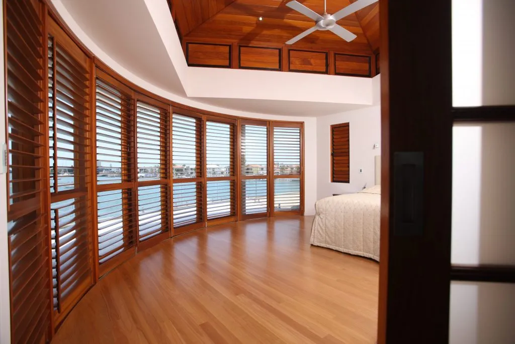 Western Red Cedar plantation shutters around a curved bay window