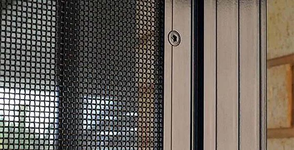 Close-up of Crimsafe security mesh and door frame lock