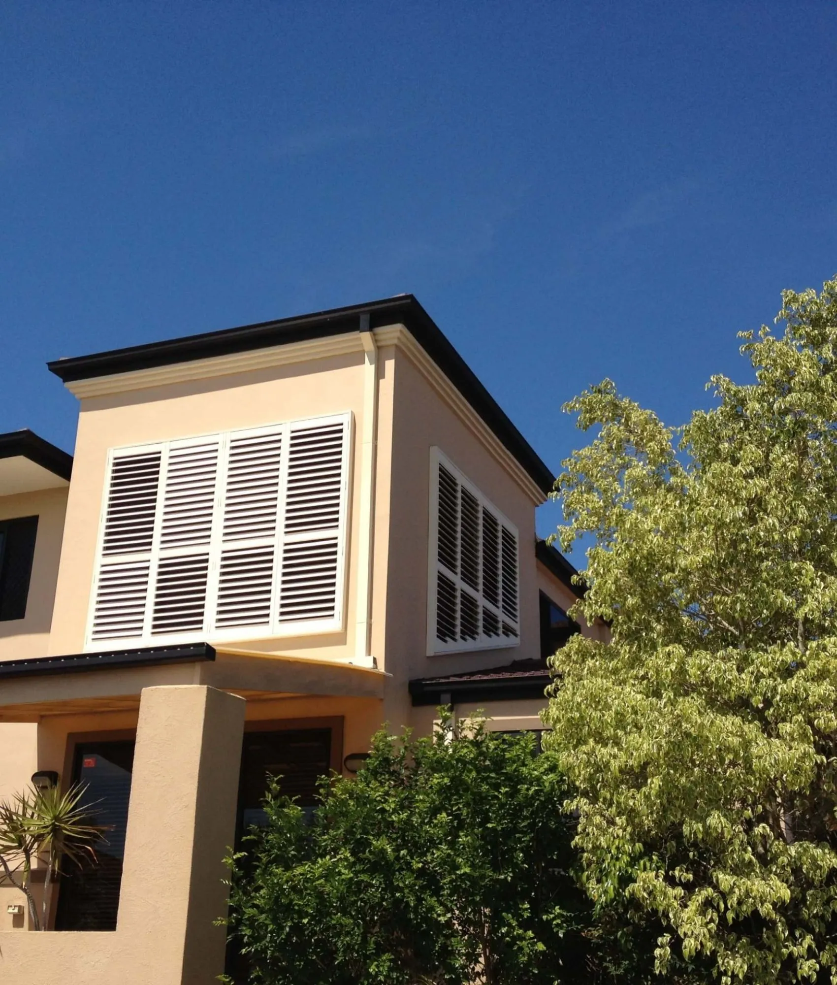 Aluminium plantation shutters on a two-storey home