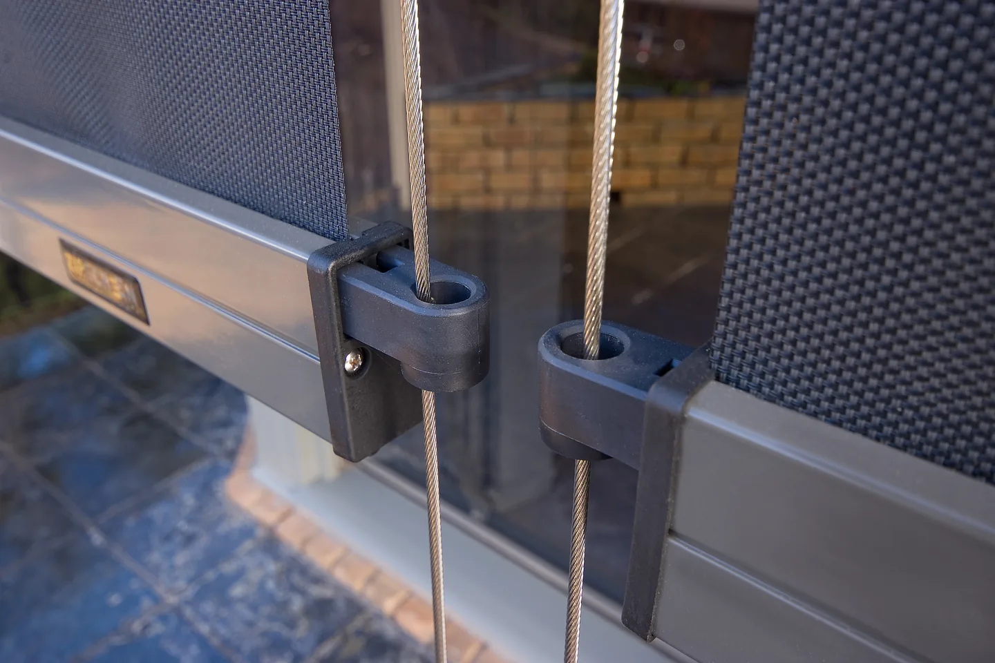 Two bottom bars side by side, each running on a pair of stainless guide wires