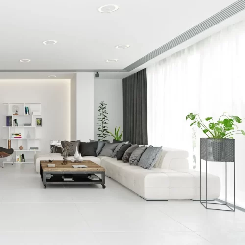 White living room with sheer and grey curtains