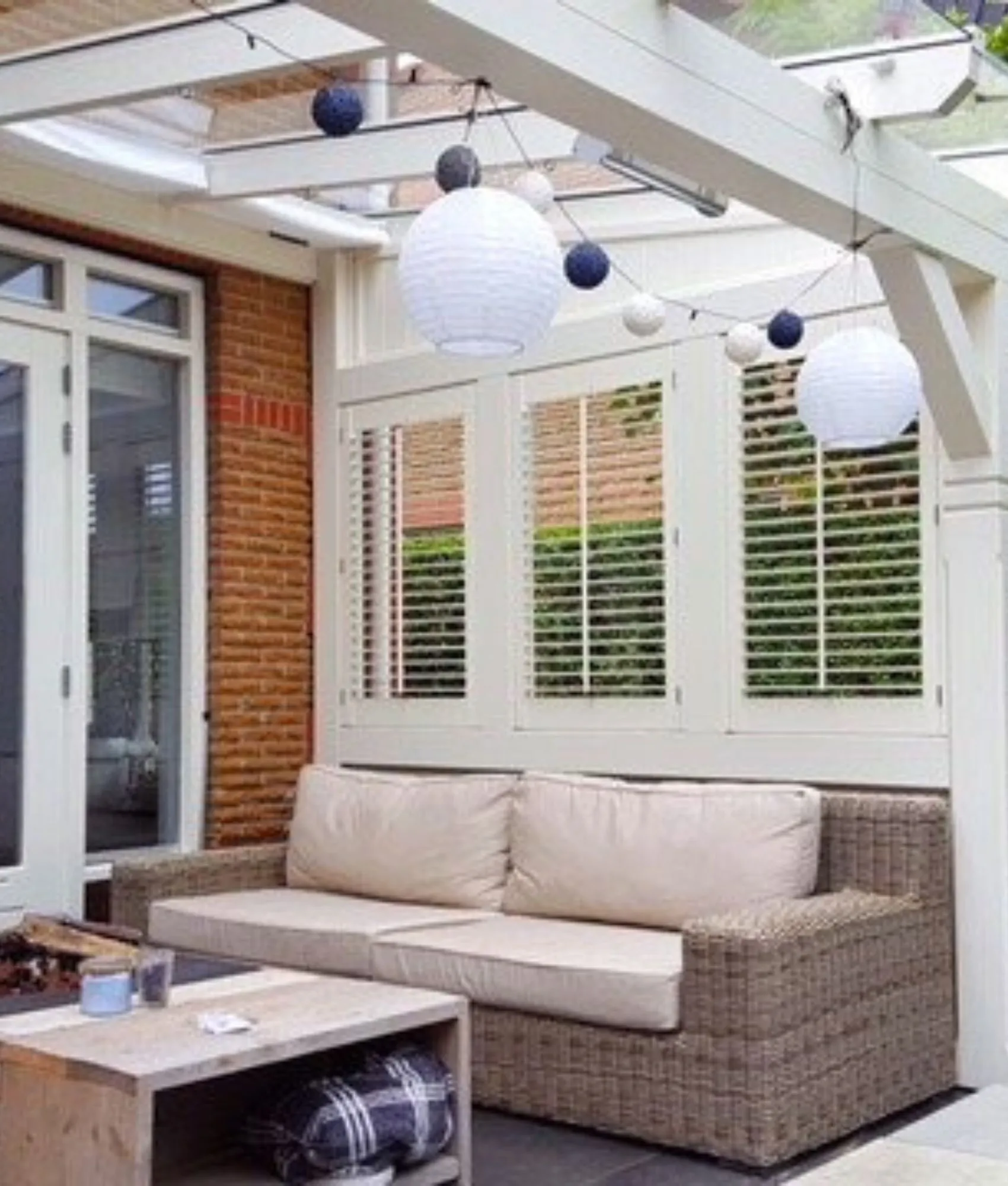Outdoor plantation shutters on a covered patio