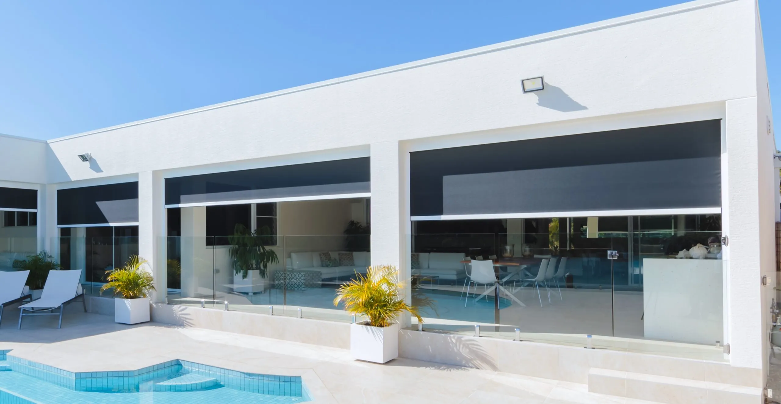 Zipscreen blinds on a poolside home