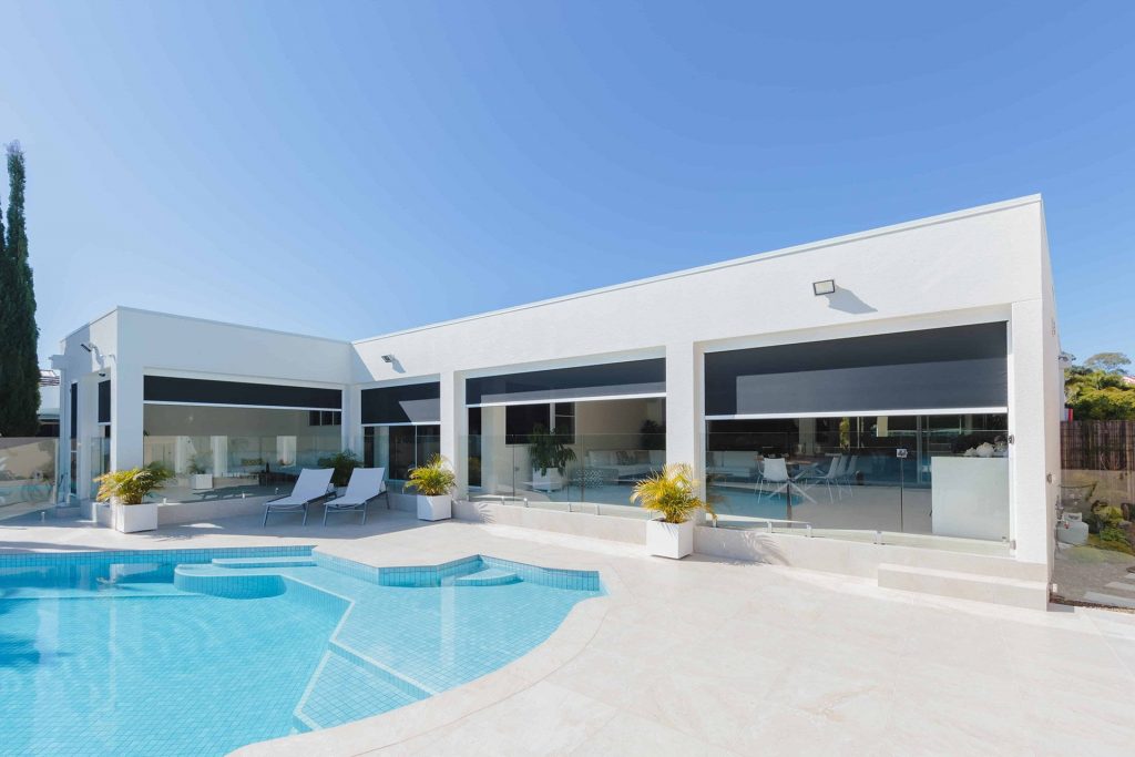 Stanbond SA - Outdoor Blinds Adelaide - Image of poolside outdoor patio with Zipscreen blinds