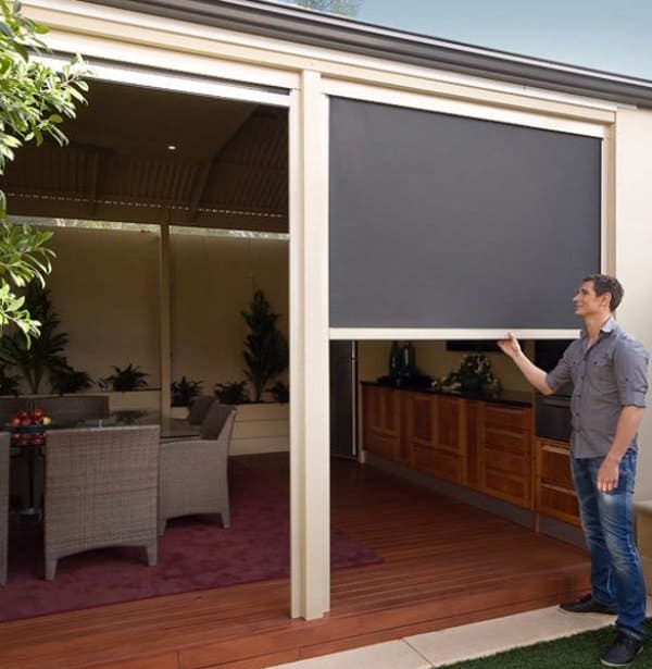 Stanbond SA - Outdoor Blinds Adelaide - Image of man adjusting a Zipscreen outdoor blind
