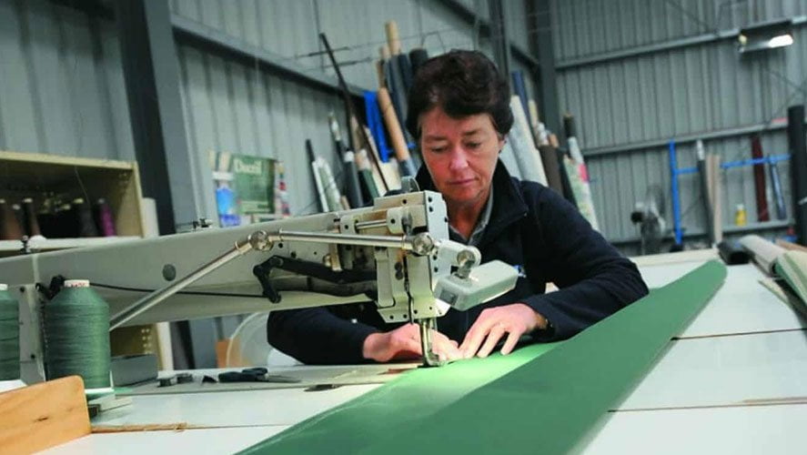 Stanbond SA - Blinds Adelaide - Image of lady sewing a blind on a machine