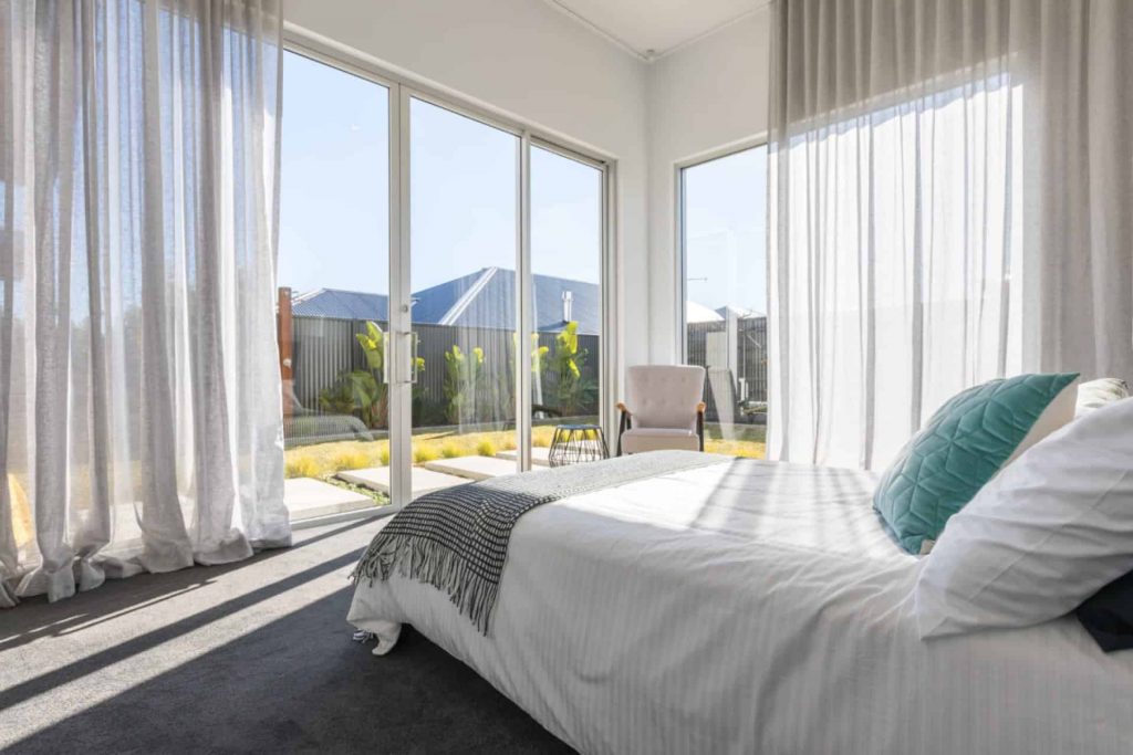 Stan Bond SA - Indoor Blinds Adelaide - Image of modern bedroom with sheer curtains