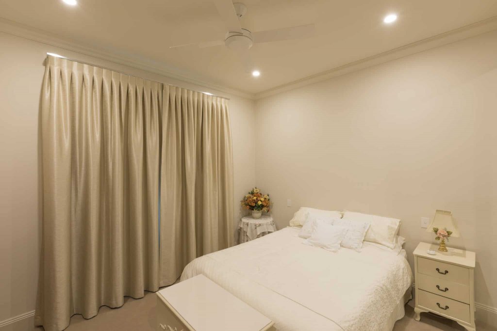 Stan Bond SA - Blinds Adelaide - Image of white bedroom with classic curtains