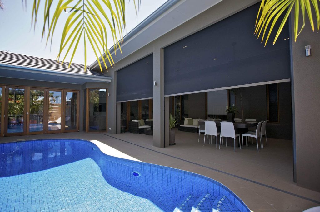 Stan Bond SA - Outdoor Blinds Adelaide - Image of Ziptrak blinds on a poolside patio